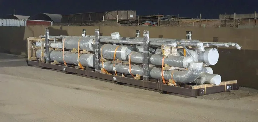 Packaged spools on transport skid